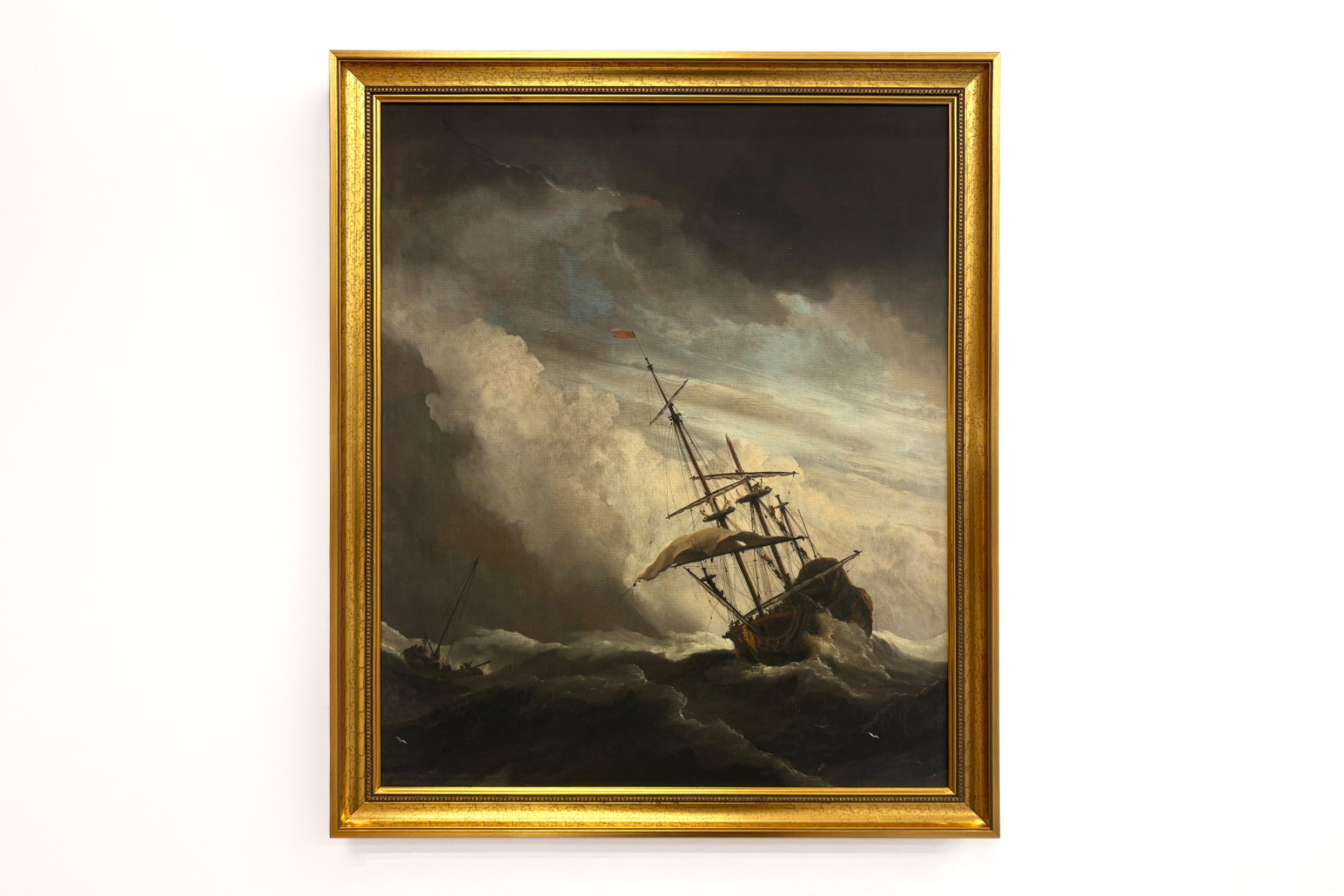 Et skib på åbent hav fanget af en vindbyge, kendt som «Vindstødet» - Willem van de Velde (II)