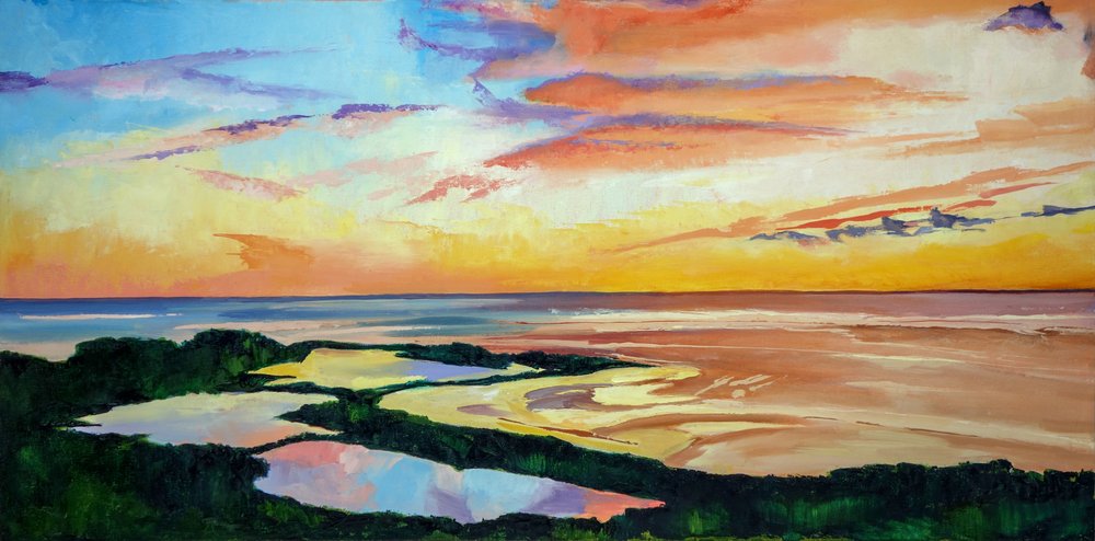 En livlig solnedgang ved kysten af Maxine Shore