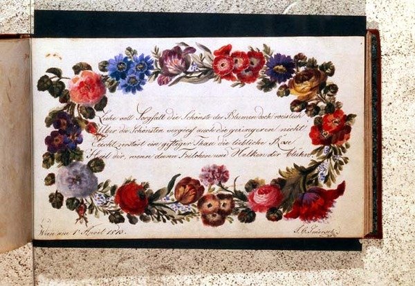 Frontispice af en besøgsbog dekoreret med et epigram på tysk omgivet af en blomsterkrans, dateret 1. april 1813 (wc) af Austrian School