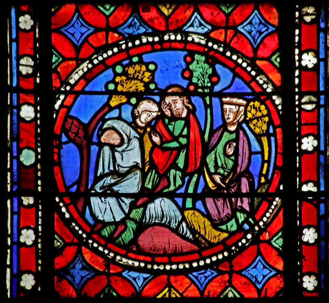 Vindue, der viser scene fra Saint Bonnets liv: Bonnet og hans familie finder sin far, der pludselig var død i vejkanten af French School