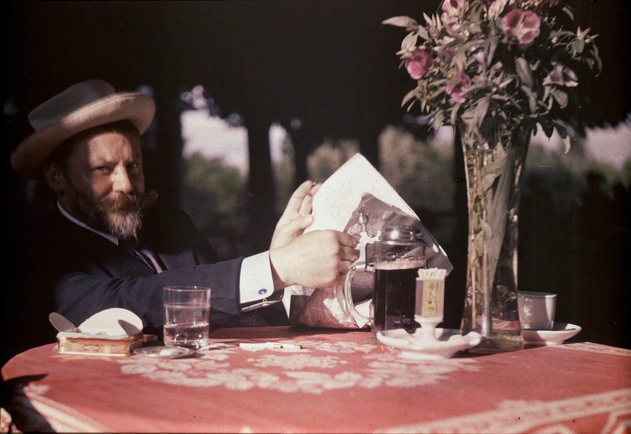 Frank Eugene sidder ved bordet af Alfred Stieglitz