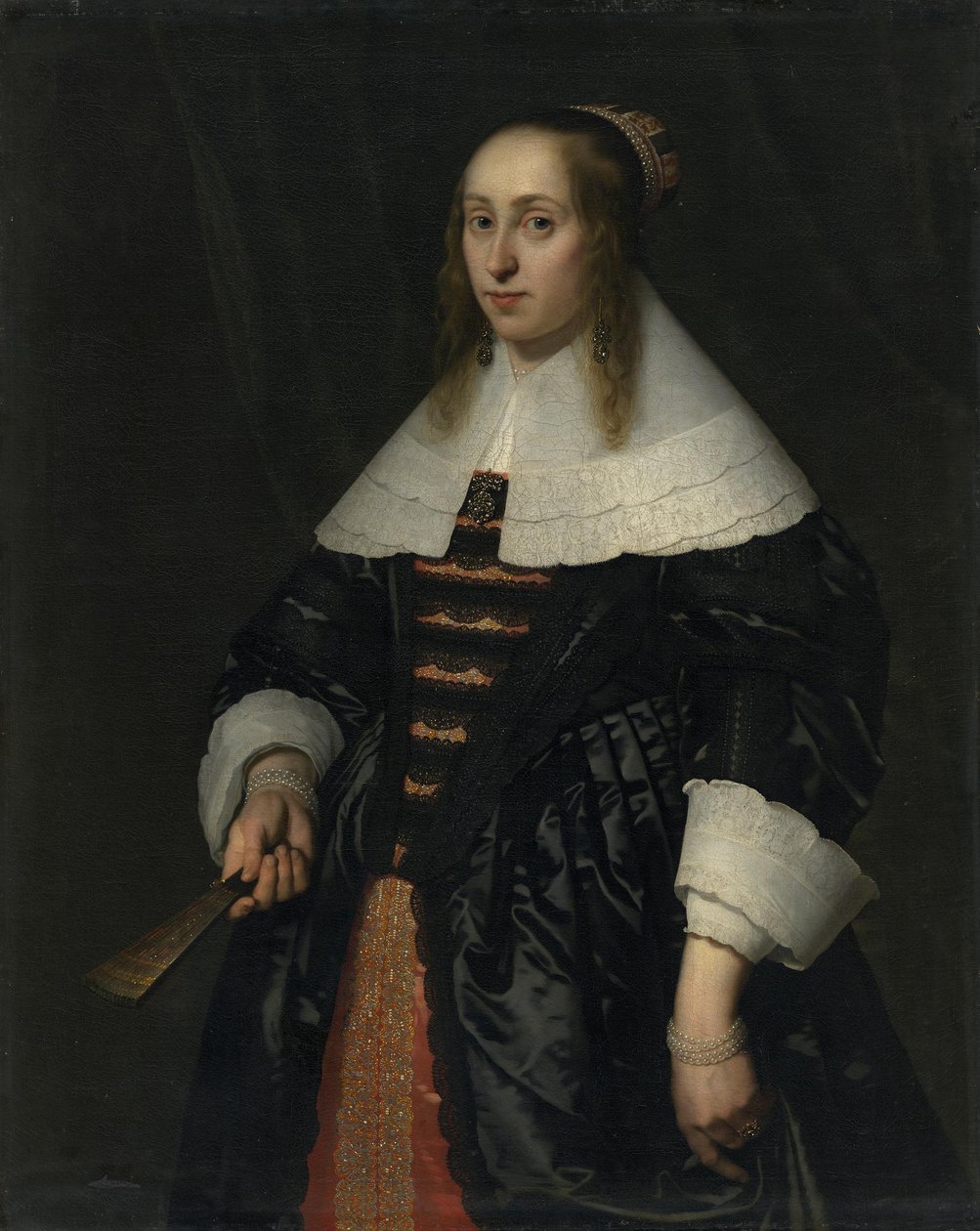 Portræt af en kvinde i en sort atlaskjole af Bartholomeus van der Helst