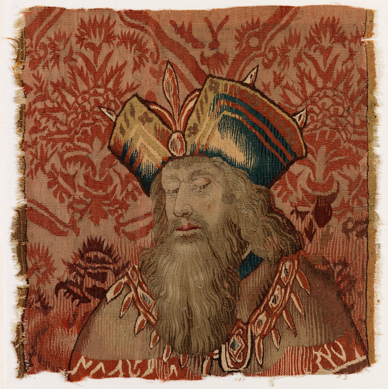 Tapestrypanel, der forestiller hovedet af en præst eller konge, muligvis lavet i Tournai, Belgien, muligvis tidligt i det 16. århundrede (uld) af Belgian School