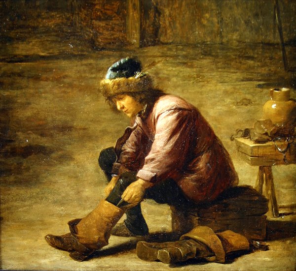 En ung mand trækker i en støvle af David Teniers the Younger