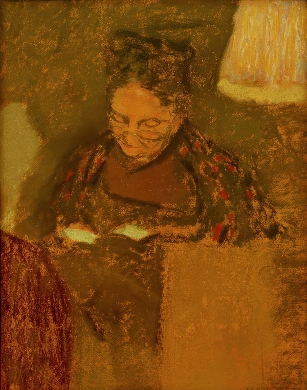 Madame Vuillard læser ved lyset af en lampe af Edouard Vuillard