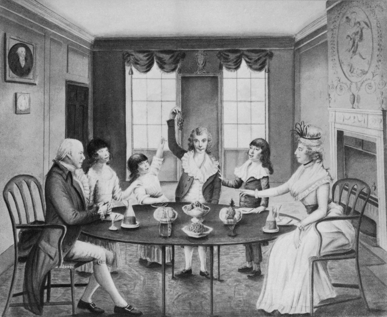 An interior with a lady and gentleman seated at a table with their four children standing beyond it, c.1780dani af English School