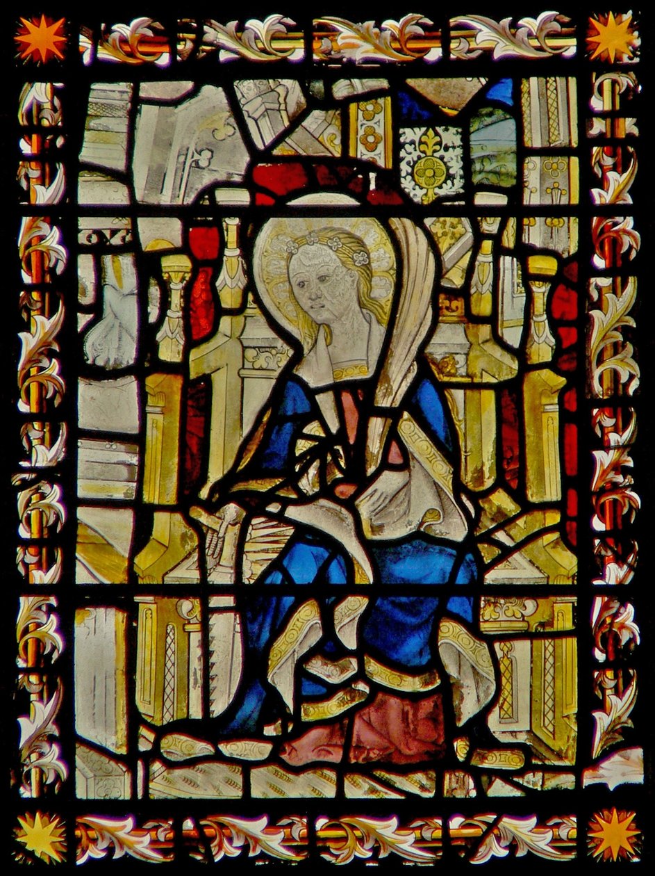 Det østlige vindue viser St. Faith, der bærer hendes emblem, saven af English School