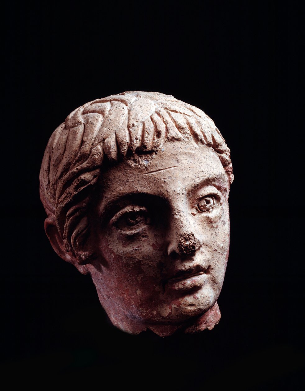 Etruscan civilization: head of a young man from the temple of Belvedere, in Orvieto - 5th-4th century BC Diam 13 cmdani af Etruscan