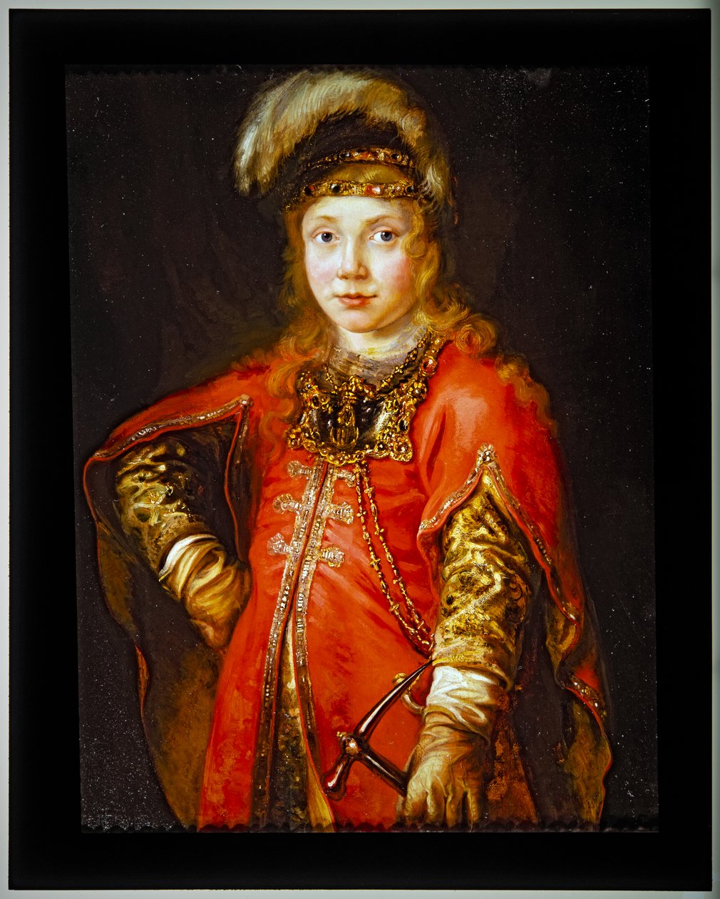 Portræt af en ung mand i rød tunika af Ferdinand Bol