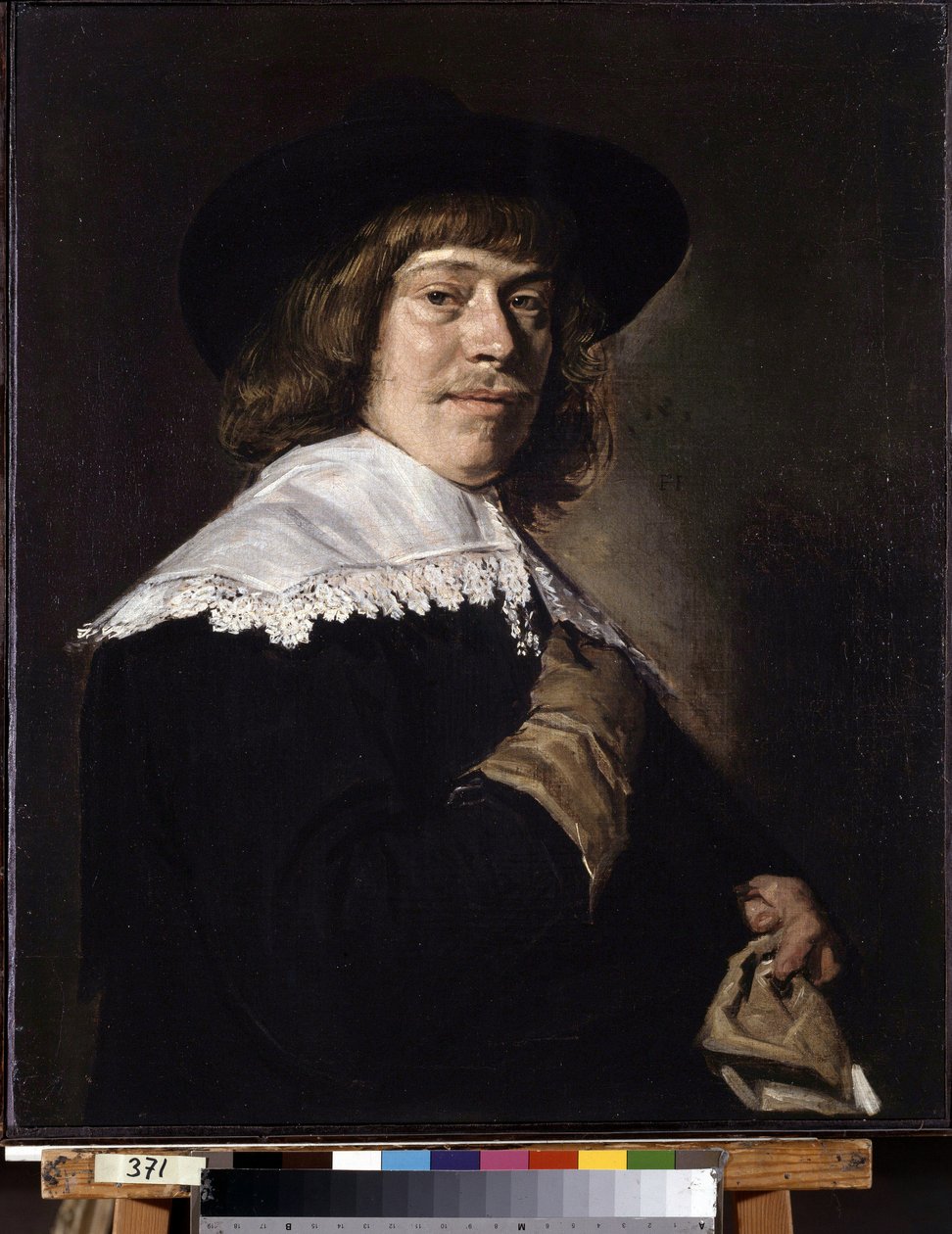 Portræt af en mand med en handske. Portræt af en ung mand, der holder en handske. Maleri af Frans Hans Hals I (1581-1666), ca. 1650. Olie på lærred. Hollandsk kunst, barokstil. Eremitagemuseet, Sankt Petersborg. af Frans Hals