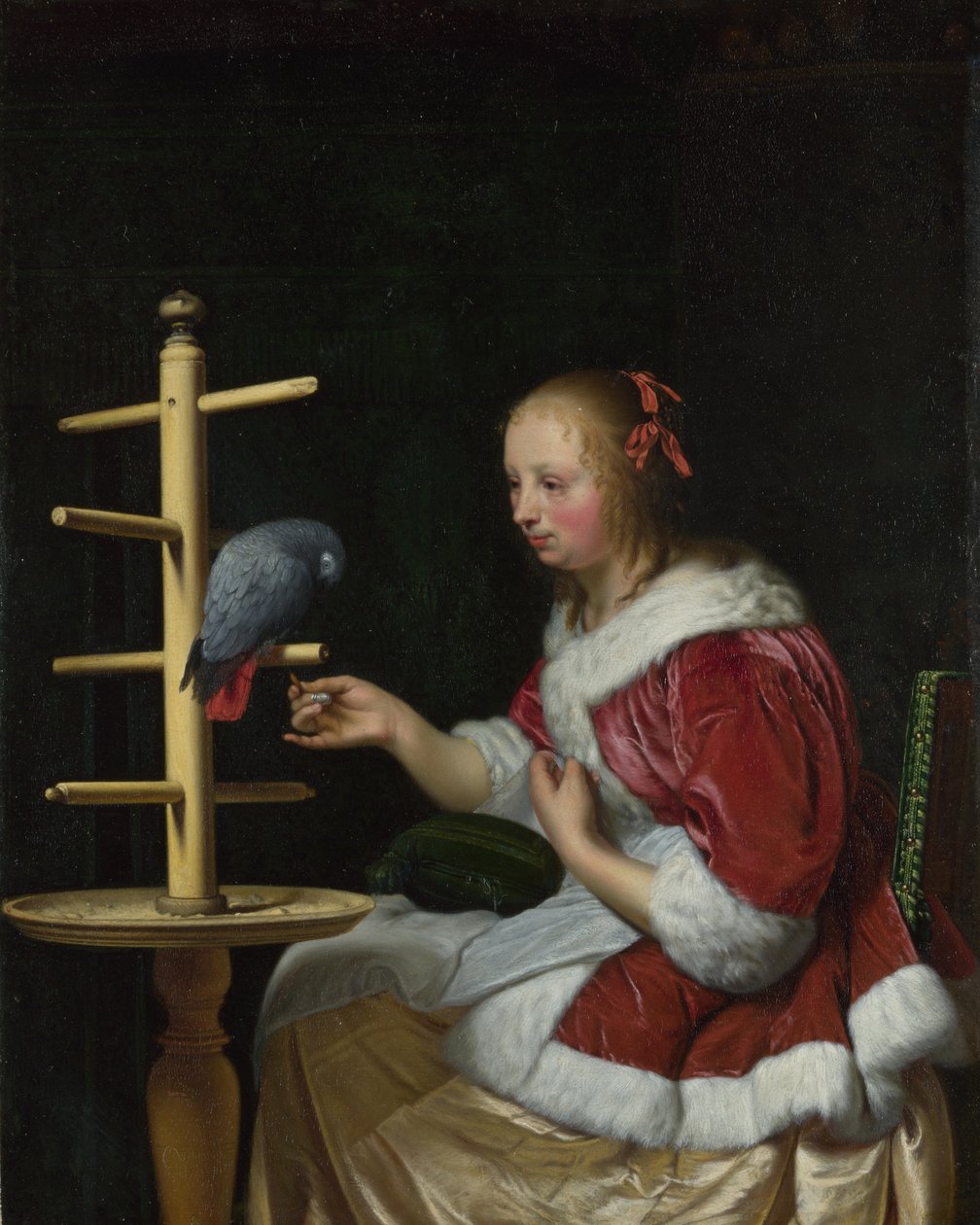 En kvinde i en rød jakke fodrer en papegøje, ca 1663 af Frans van Mieris the Elder