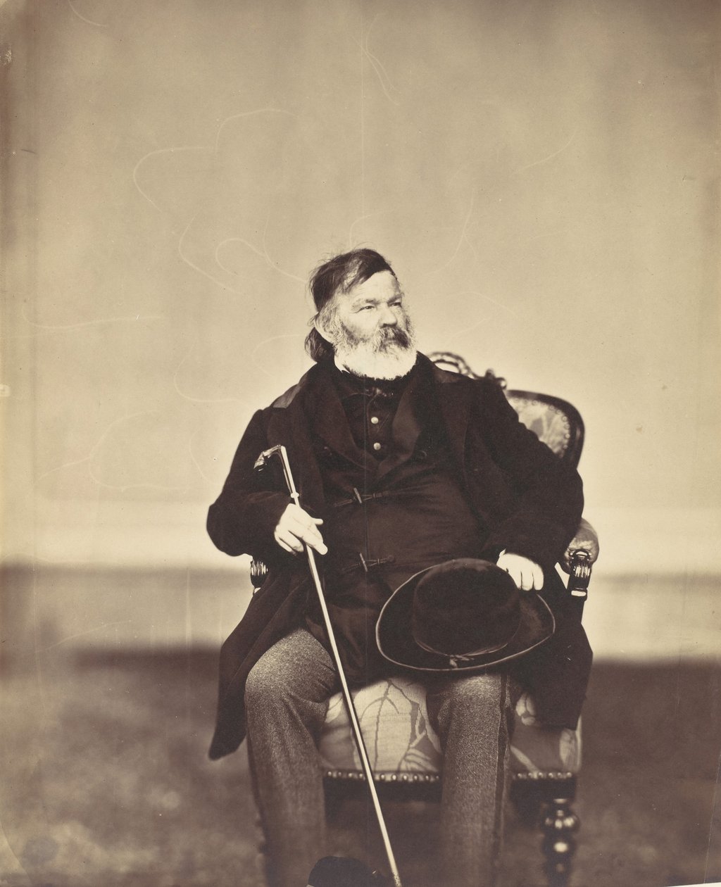 [Siddende mand med stok og hat], 1850