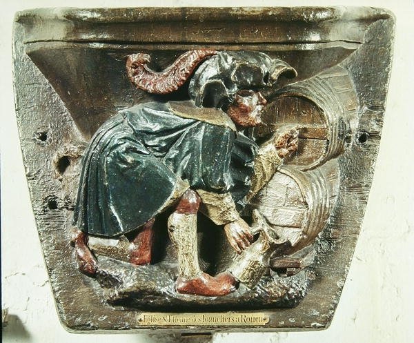 Misericord fra en korbod, der forestiller en mand, der tester vin, fra kirken Saint-Etienne des Tonneliers, Rouen (polykromt træ) af French School