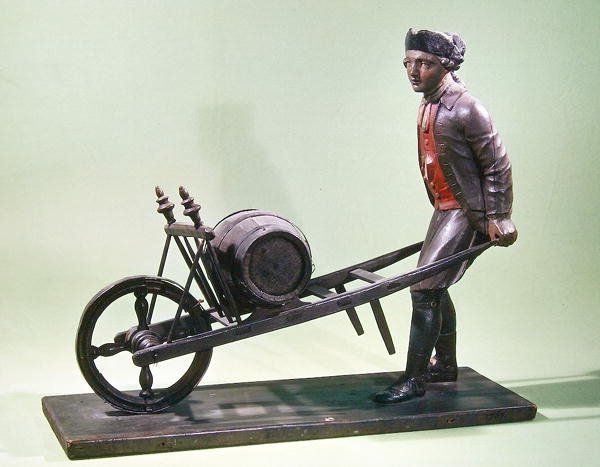 Skilt, der repræsenterer en eddikesælger med sin barrow, 1757 (polykromt træ) af French School