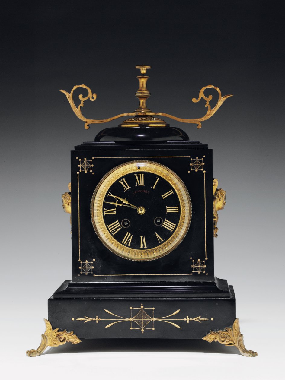 A mantle clock of black composition stone, with incised decoration, with legs, finials and fittings in gilt brass, by Jausions of Pau, France, c.1876-78dani af French School