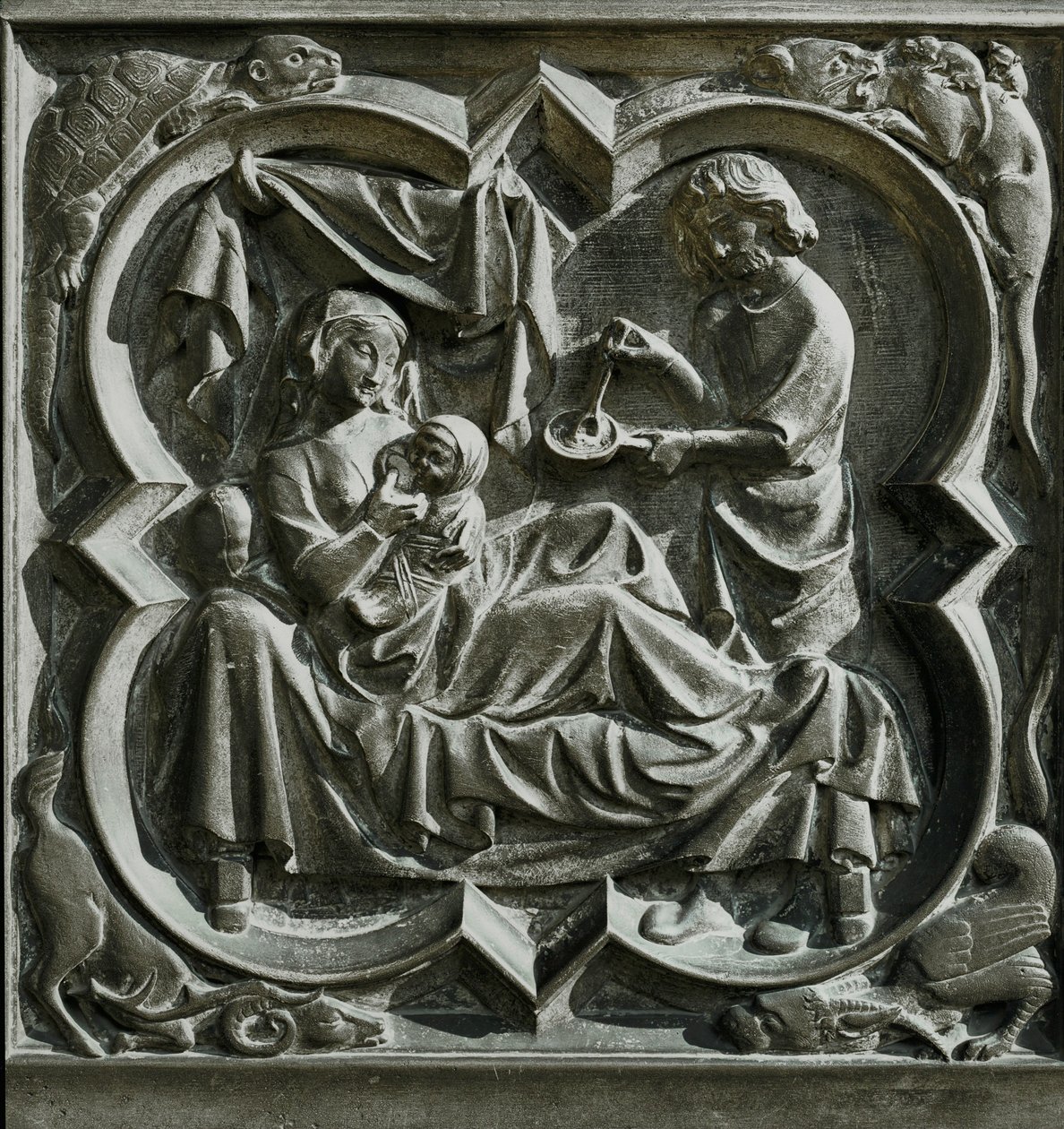 Adam laver mad, mens Eva ligger i sengen og ammer et barn ... (relief) af French School