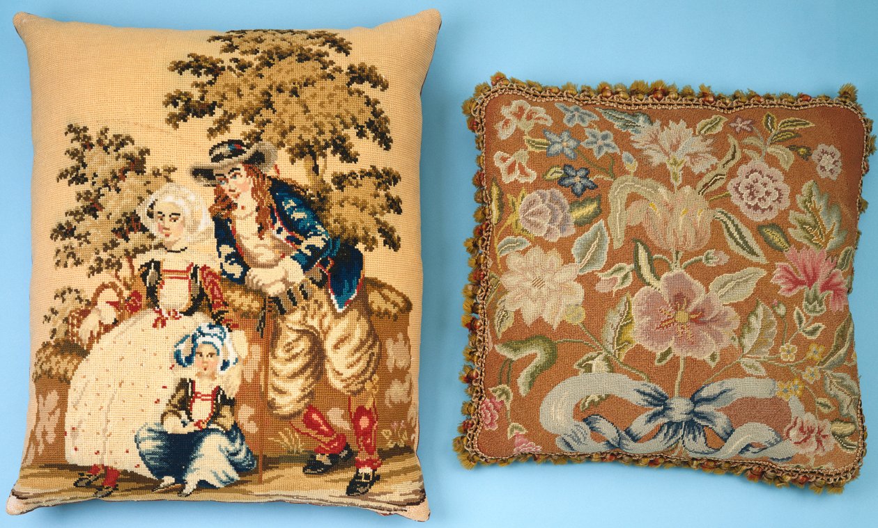 Two cushions with needlework panels worked in colored silks and wools dani af French School