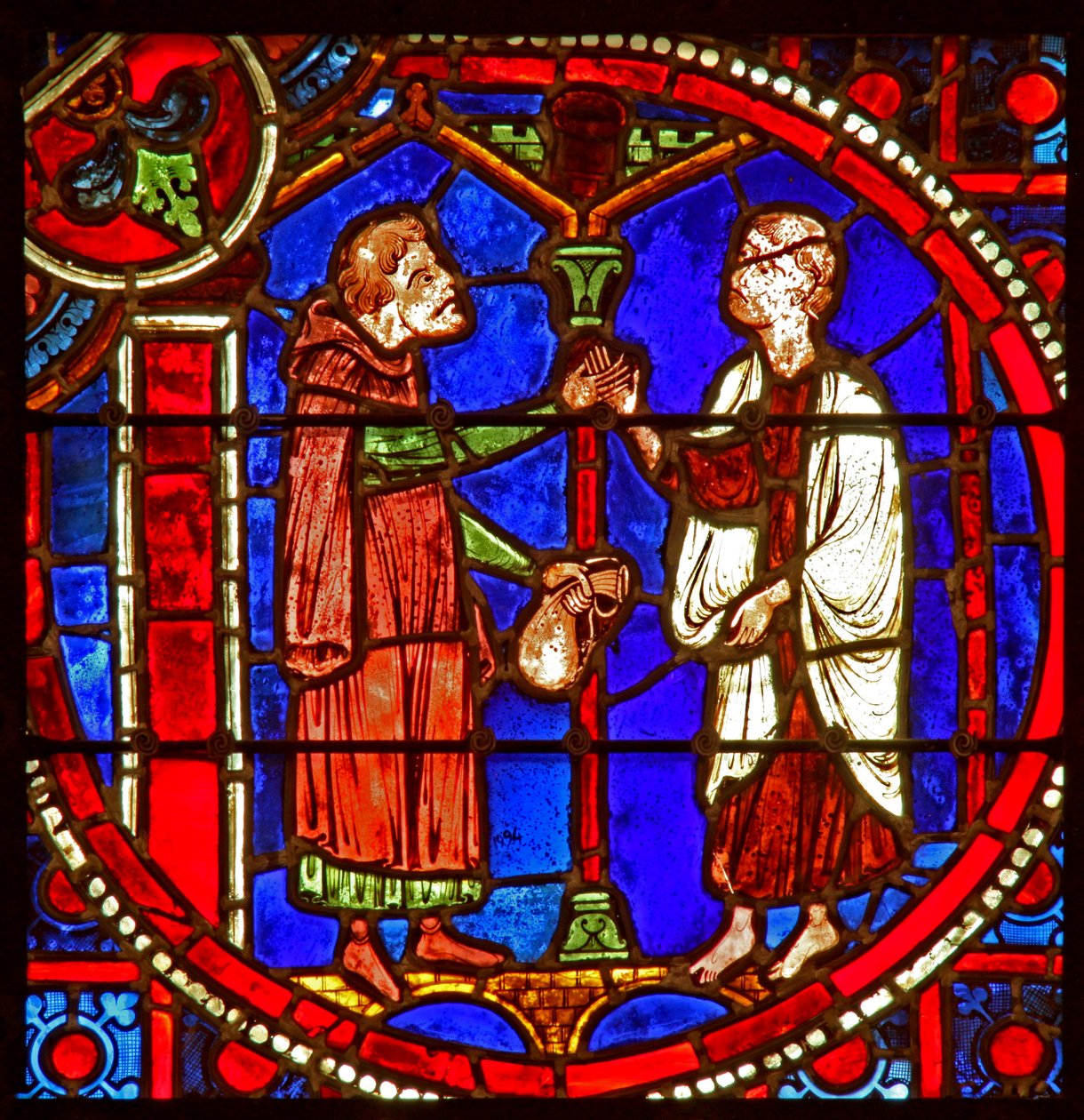 Vindue w1 skildrer en scene fra Theophilus-historien: han beder om hjælp fra en tryllekunstner af French School