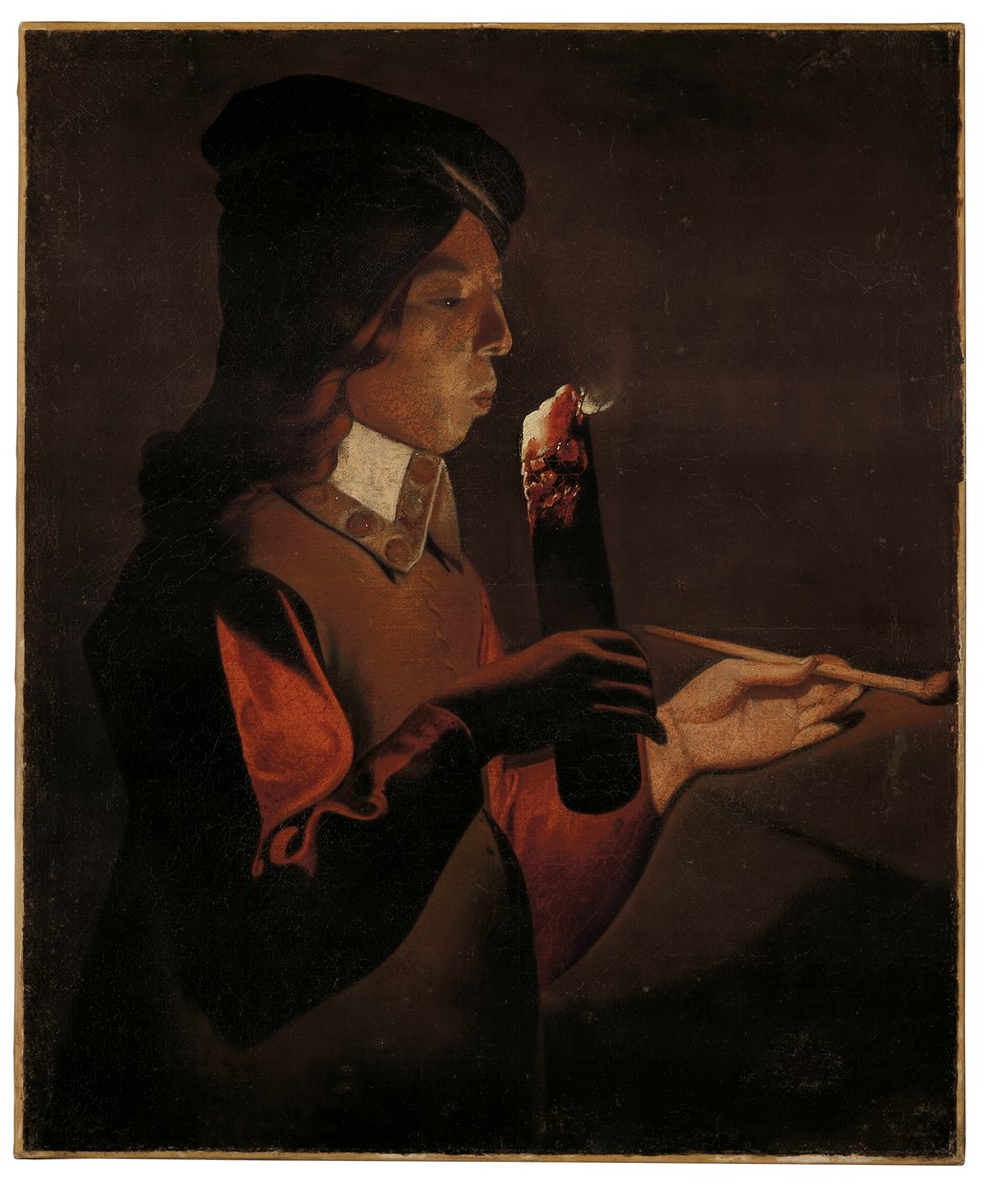 En ung dreng med en pibe, der blæser på en ildsjæl (olie på lærred) af Georges de La Tour
