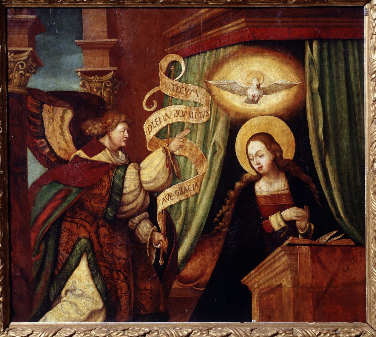 Bebudelsen (The Annunciatioon). Ærkeenglen Gabriel bringer et budskab på latin: ""Ave gratia plena Dominus tecum"" (Hil dig, o fuld af nåde, Herren er med dig) (begyndelsen af ​​Ave Maria). Maleri af en tysk mester (1500-tallet). Olie af German School