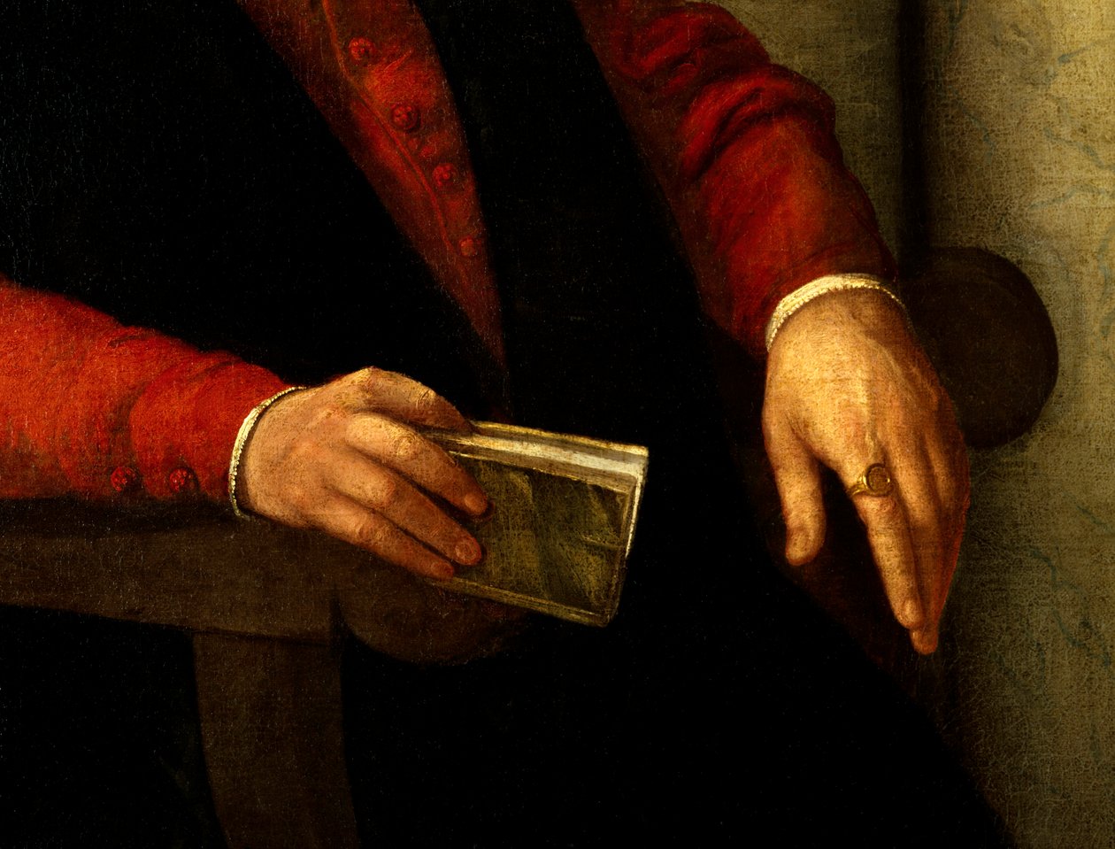 Formodet portræt af Francois Rabelais (1494-1553), fransk forfatter og læge. Detalje af bogen han holder i hånden og af ridderen han bærer på fingeren. Maleri af Giovanni Battista Moroni (1525-1578) af Giovanni Battista Moroni