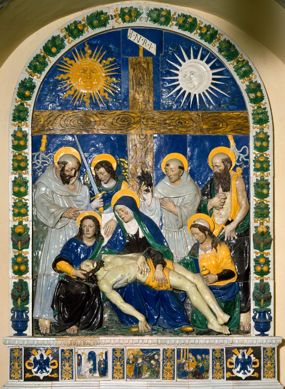 The Deposition (Pieta)” Jesus Kristus og Jomfru Maria omgivet af Sankt Johannes og Sankt Maria Magdalena før korset med inskriptionen INRI (I.N.R.I.) Højreliefkeramik af Giovanni della Robbia (1469-1529) 1525 Dim. 287x210 cm Santuario della V af Giovanni della Robbia