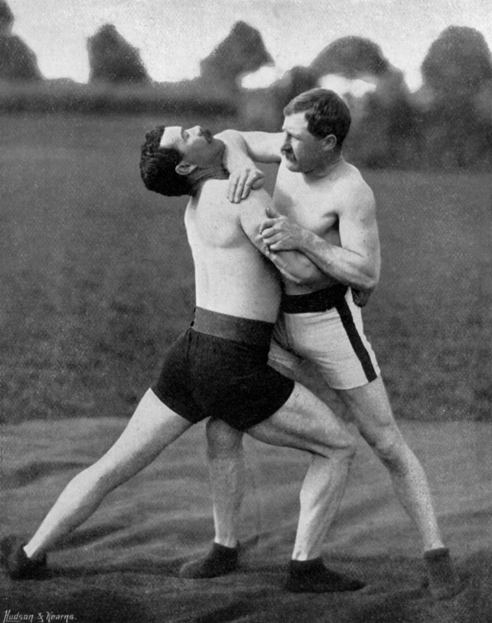 The body holt and neck double, wrestling display, Aldershot, Hampshire, 1896 af Gregory and Co