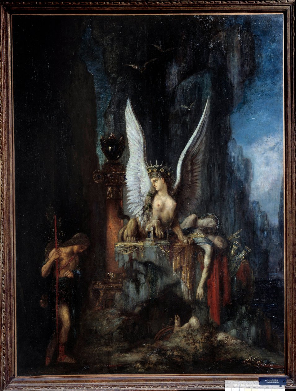 Den rejsende eller Ødipusrejsende eller Egalitten før Døden Ødipus foran sfinksen. Maleri af Gustave Moreau (1826-1898) 1800-tallet søn. 0,93x1,24 m Metz, musee des Beaux Arts. - Den rejsende eller Ødipus den rejsende eller Ligestilling før døden, af Gustave Moreau