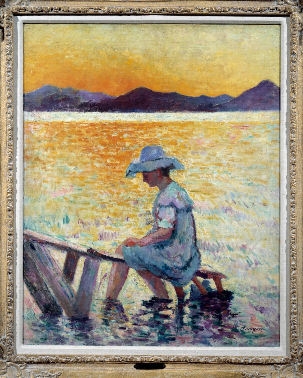 Saint Tropez, solnedgang En kvinde sidder med fødderne i vandet på kysten af Henri Charles Manguin