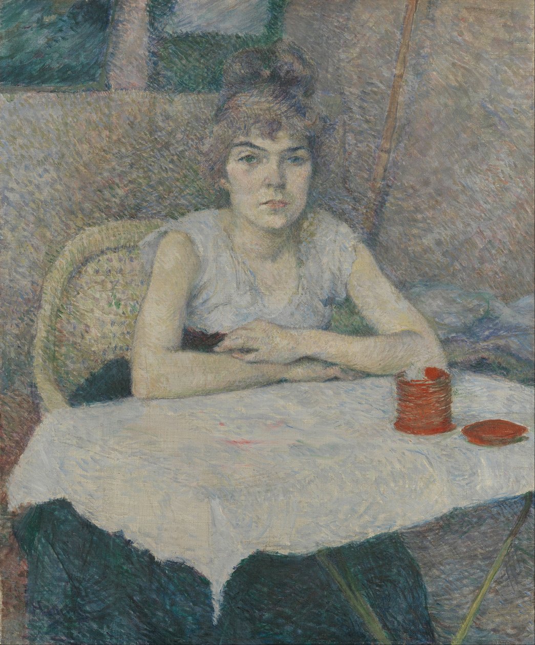 Ung kvinde ved et bord, 