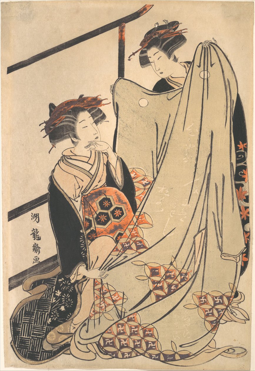 To skønheder ser på en kimono af Isoda Koryusai