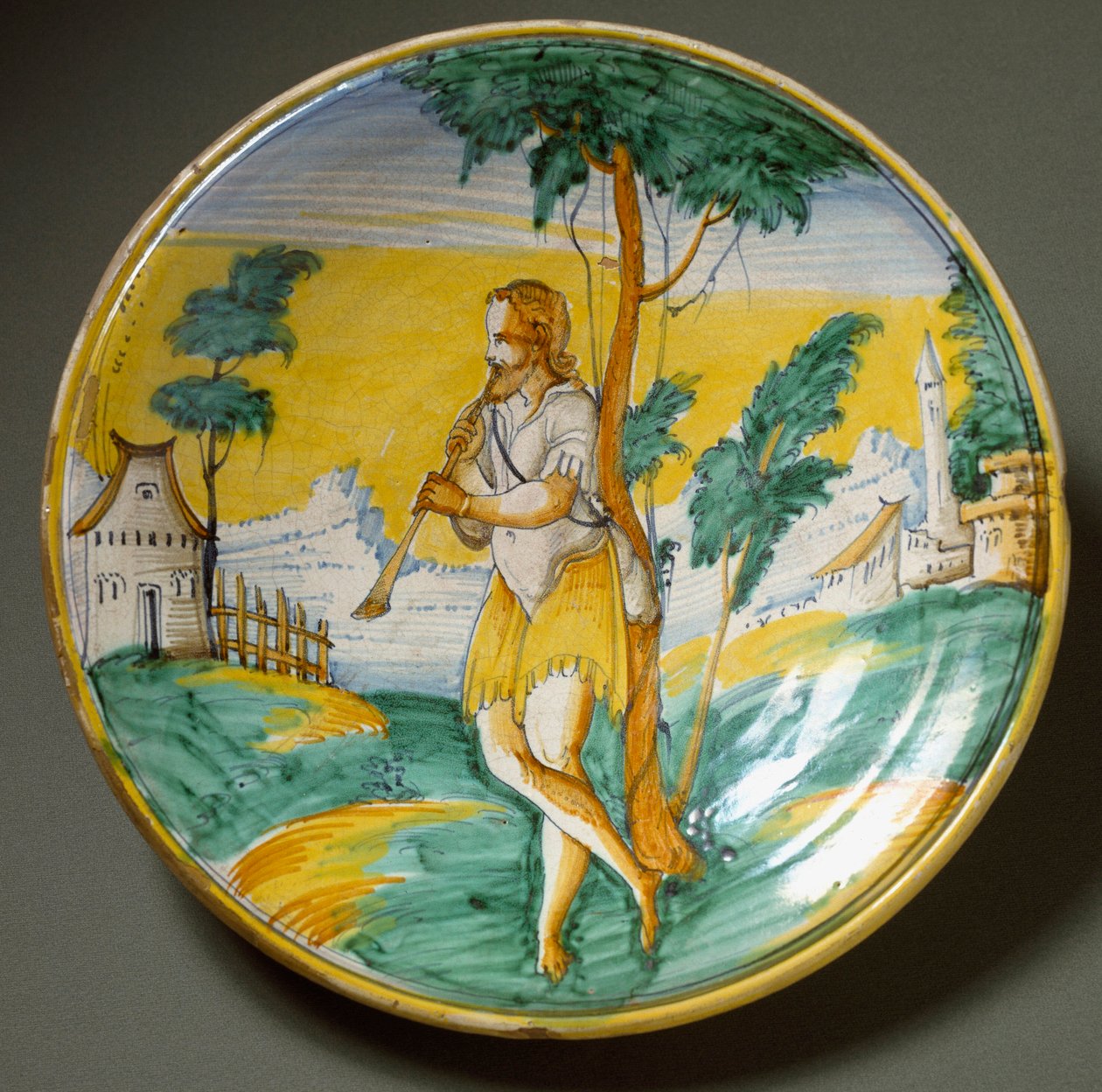 Fløjtespiller i et landskab. Keramisk plade produceret i Viterbo, Italien. Slutningen af det 16. århundrede Firenze, Museo Nazionale del Bargello af Italian School