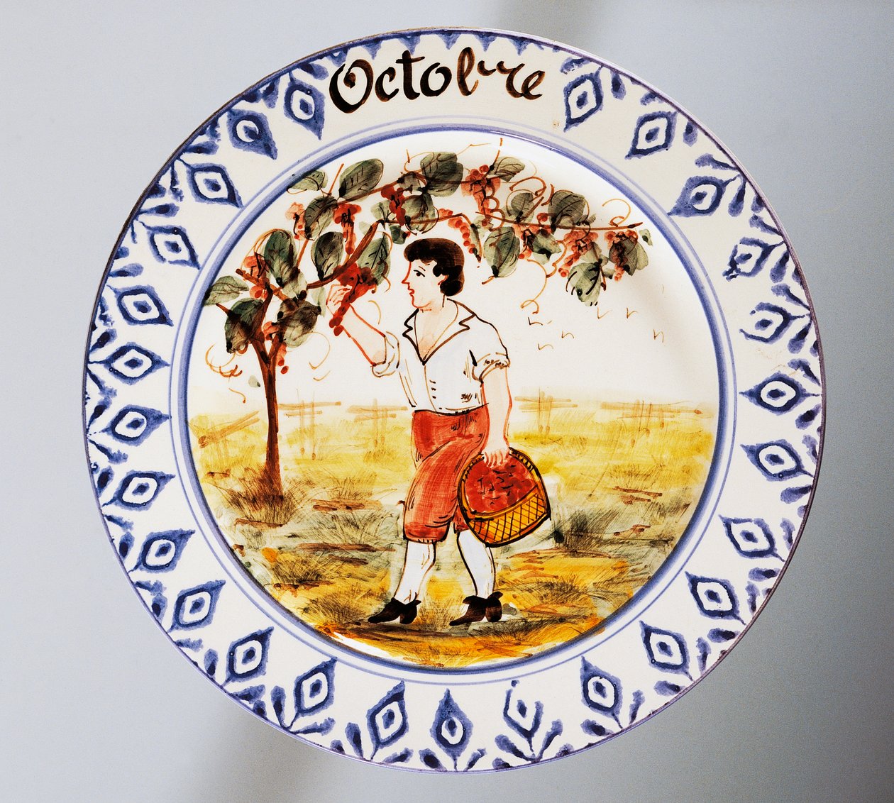 Tallerken med månedsmotiver, oktober, lertøj, Nove di Bassano-produktion, Veneto-regionen, Italien, 20. århundrede. af Italian School