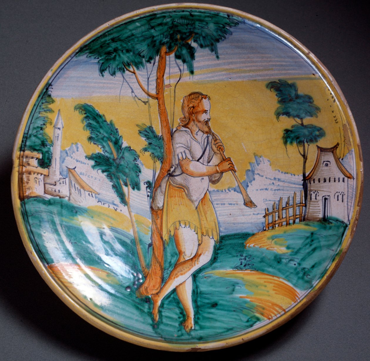 Renæssancekunst: pladedekoreret af en fløjtespiller (En fløjtespiller) - Slut 1500-tallets produktion af Viterbo (Viterbo), Italien Firenze, Museo Nazionale del Bargello af Italian School