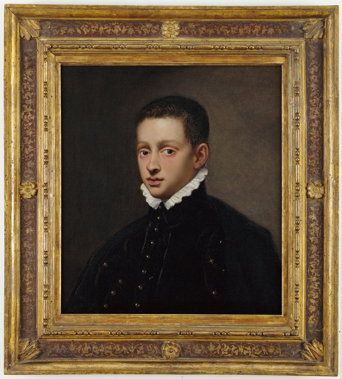 Portræt af en dreng, brystlængde, i en sort dublet med hvid krave af Jacopo Robusti Tintoretto