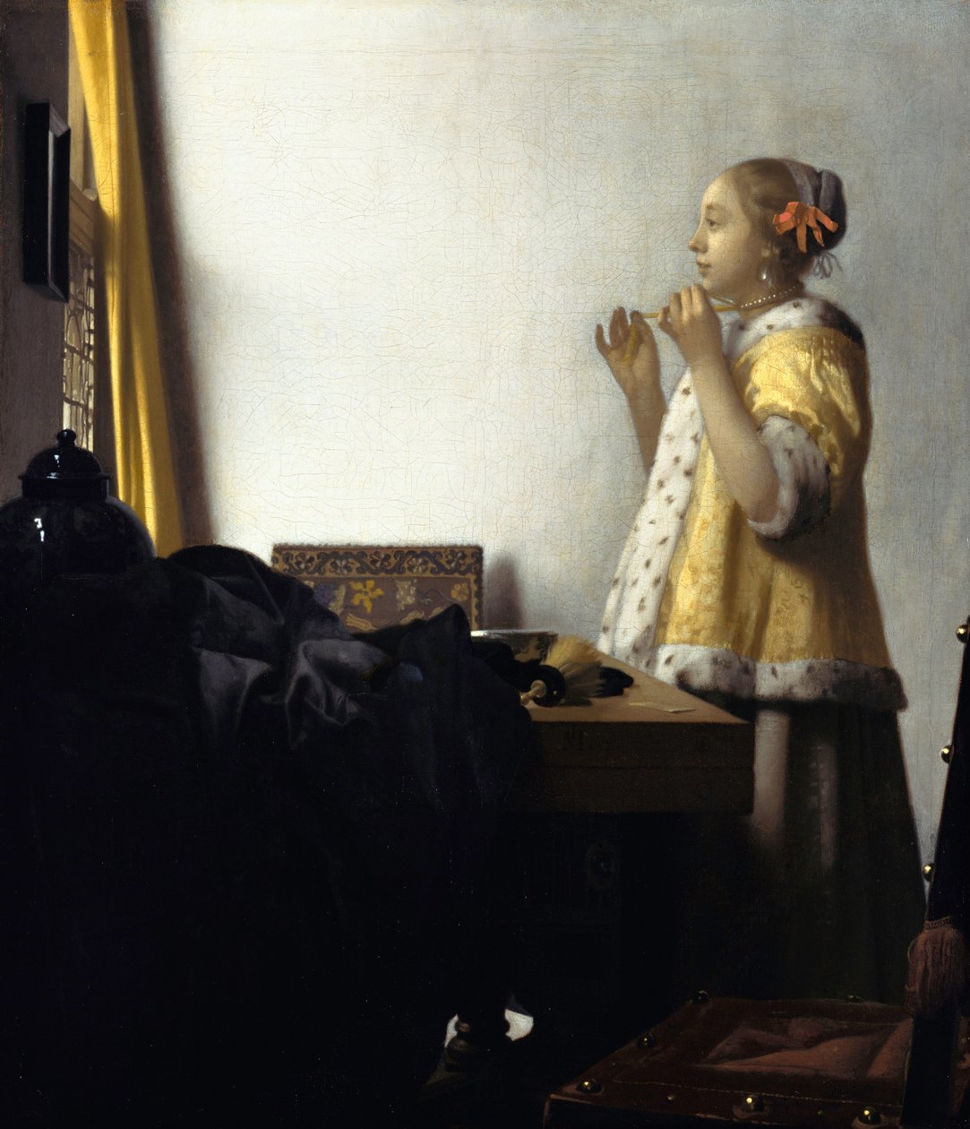 Ung kvinde med en perlehalskæde af Jan Vermeer van Delft