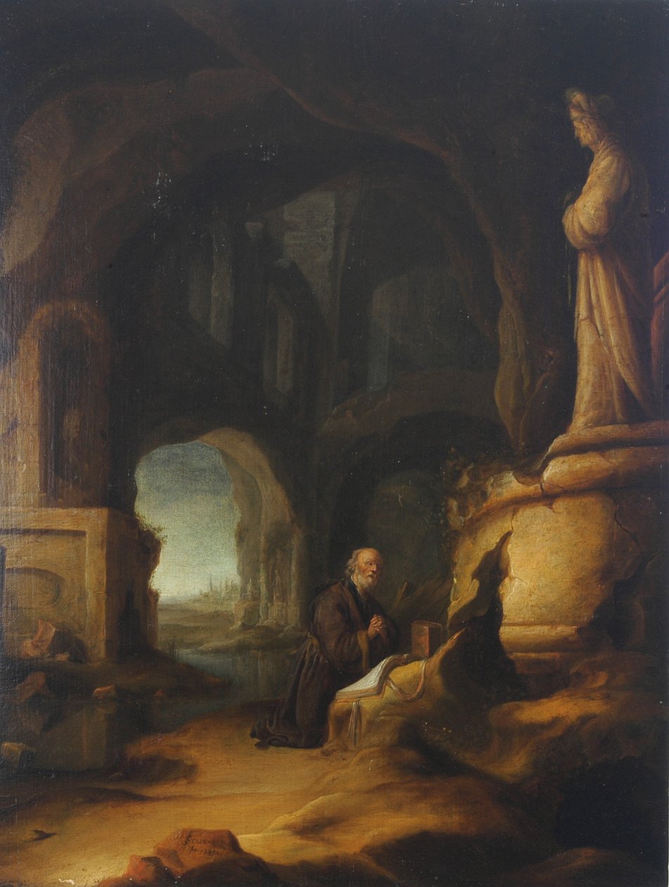 En eremit ved bøn i en grotte med klassiske ruiner af Jan Adriansz van Staveren