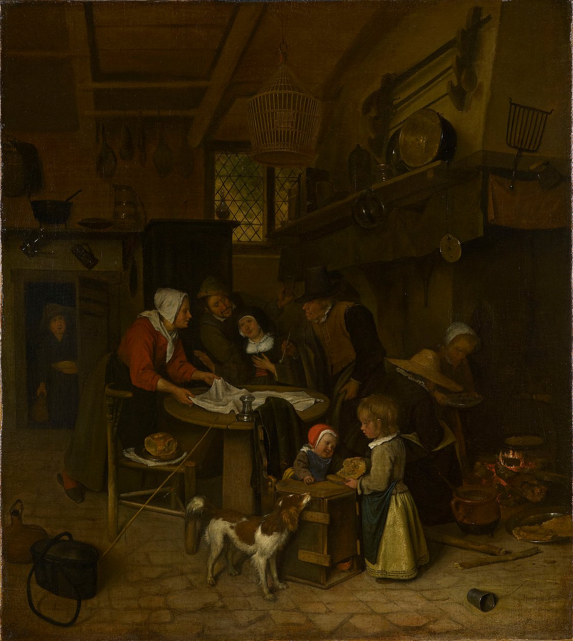 En scene i et bondekøkken med en tjener, der lægger kluden på plads af Jan Steen