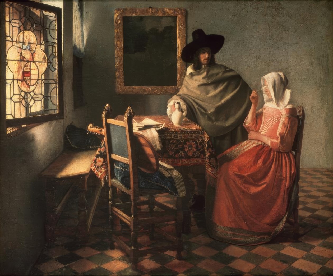 Herre og dame drikker vin af Jan Vermeer van Delft