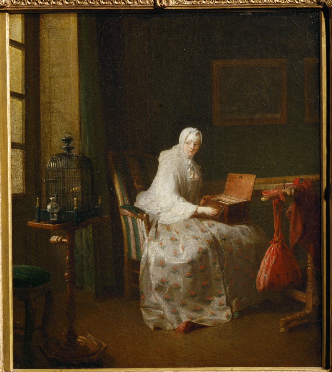 La serinette, dit aussi Dame variant ses amusements - en serinette er et lille mekanisk orgel, der bruges til at lære fugle at synge ... af Jean Baptiste Simeon Chardin