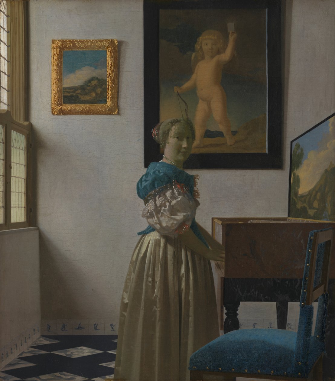 Eine junge Frau an einem Virginal af Johannes Vermeer