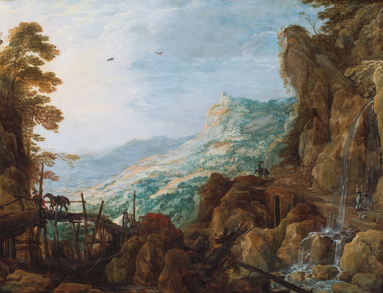 Et stenet bjerglandskab med en rytter på en bro og et vandfald (olie på panel) af Joos or Josse de The Younger Momper