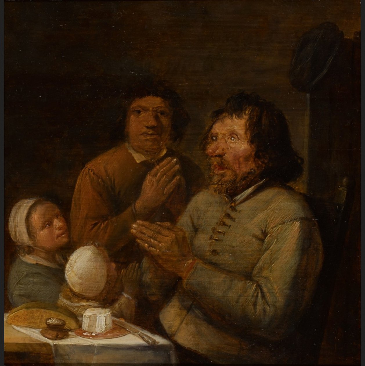 Interiør med en bondefamilie, der beder af Joos van Craesbeeck