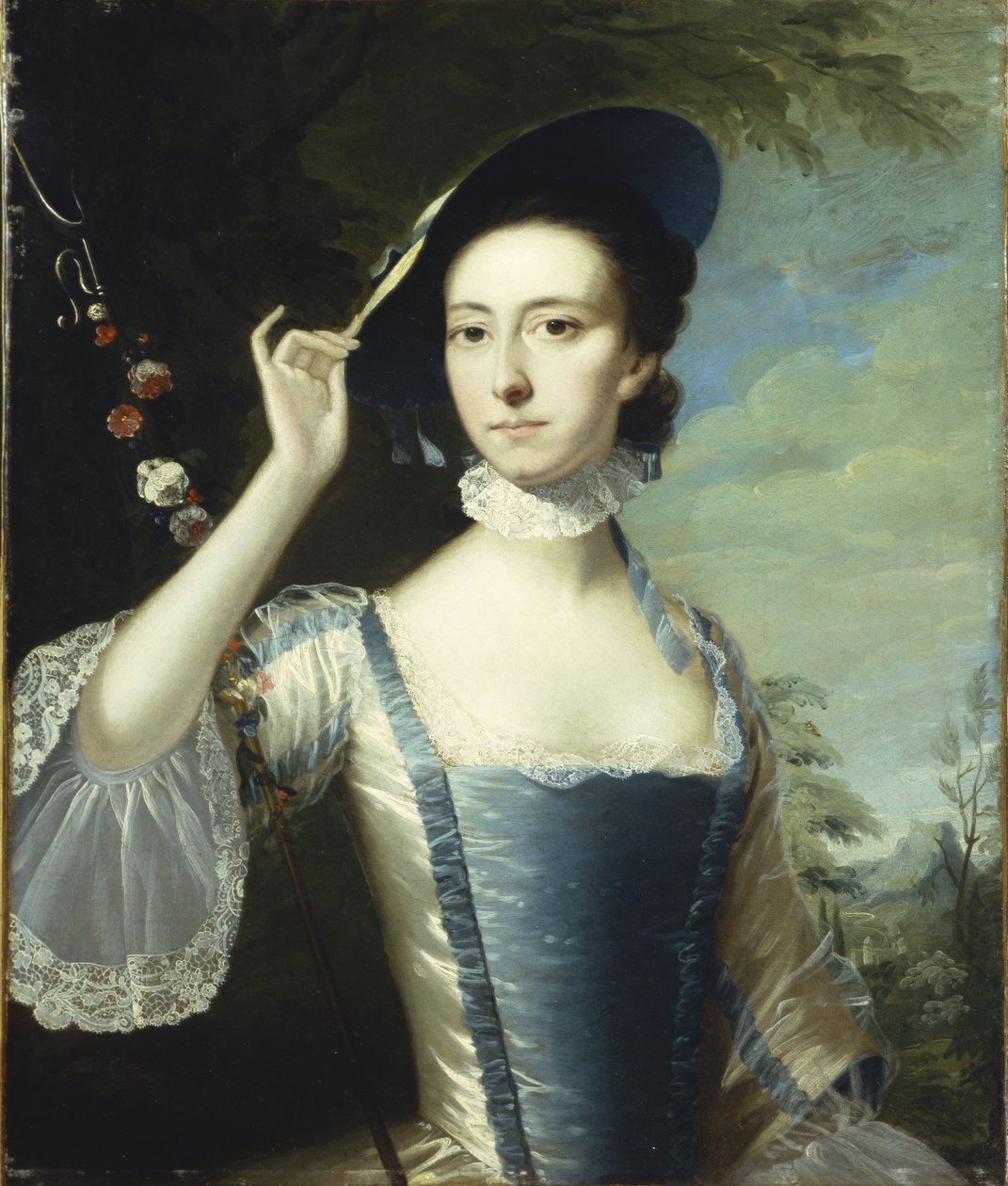 Portræt af en dame ved en krans af blomster, i et landskab af Joseph Wright of Derby