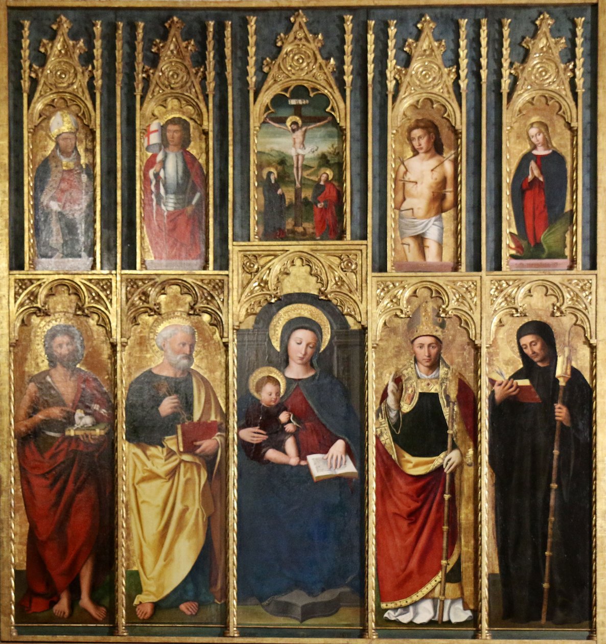 Altertavle, 10 malerier: Jomfruen med barnet mellem Johannes Døberen og Peter, En biskop og abbed, Kristus på korset mellem Johannes og Jomfruen, Sankt Martin og Sankt Viktor, Sankt Sebastian og Sankt Margaretha. af Ludovico Brea