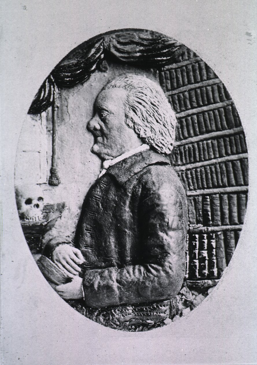 Viser bibliotekshylder og kranium af M.D. Van Eokhout