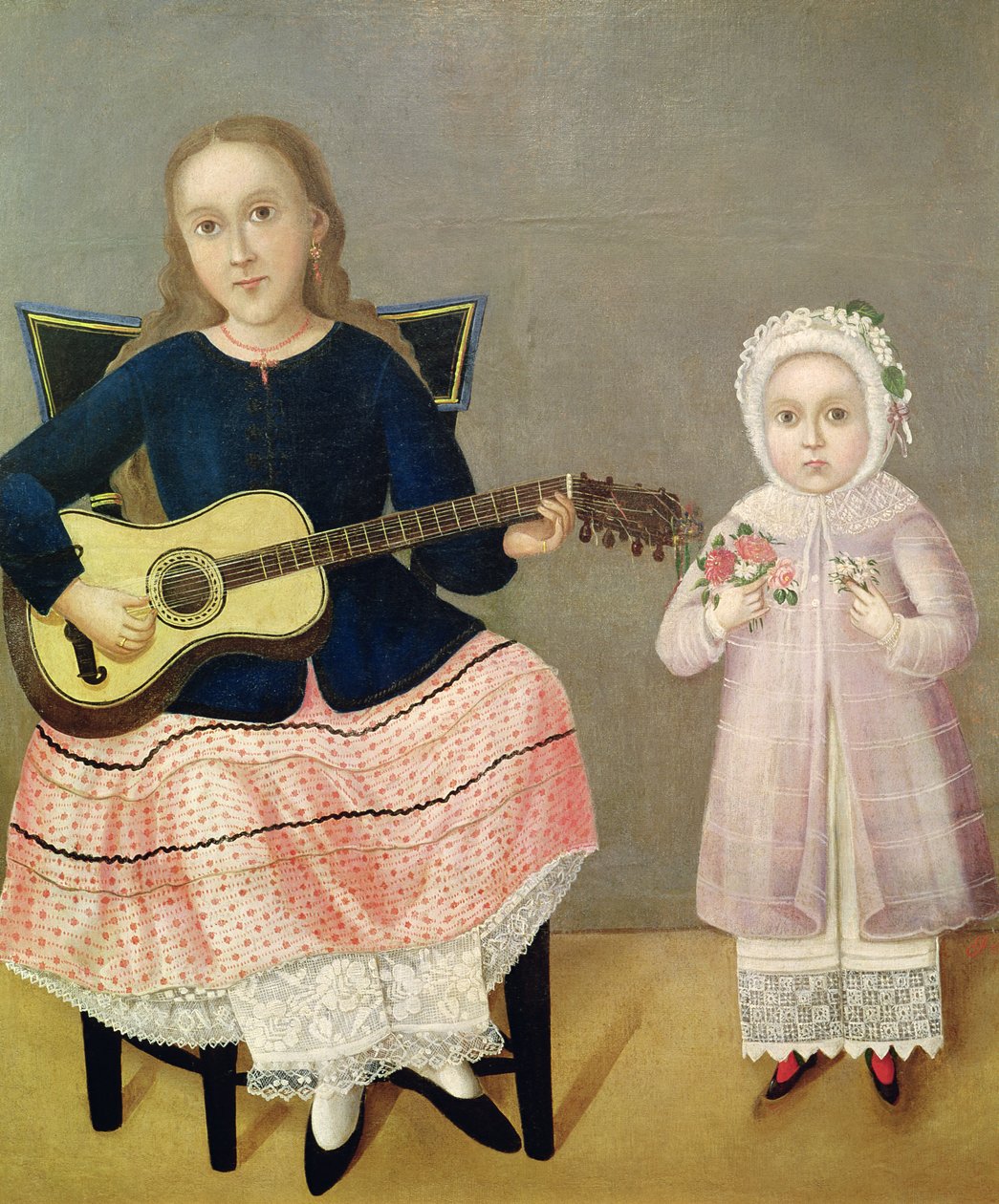 Ung pige med en guitar og et barn med en buket af Mexican School