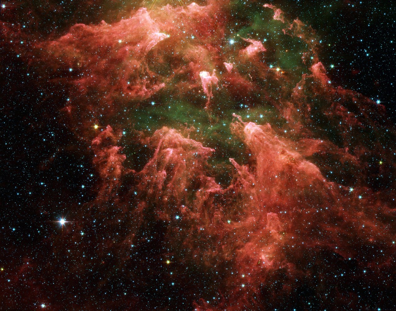 Spitzer Space Telescope billede i falske farver af den sydlige søjleregion i den tsardannende region kaldet Carina-tågen. Stjerneembryoner (gule eller hvide) inde i fingerlignende søjler af tykt støv (lyserødt). Varm g af National Aeronautics and Space Administration National Aeronautics and Space Administration