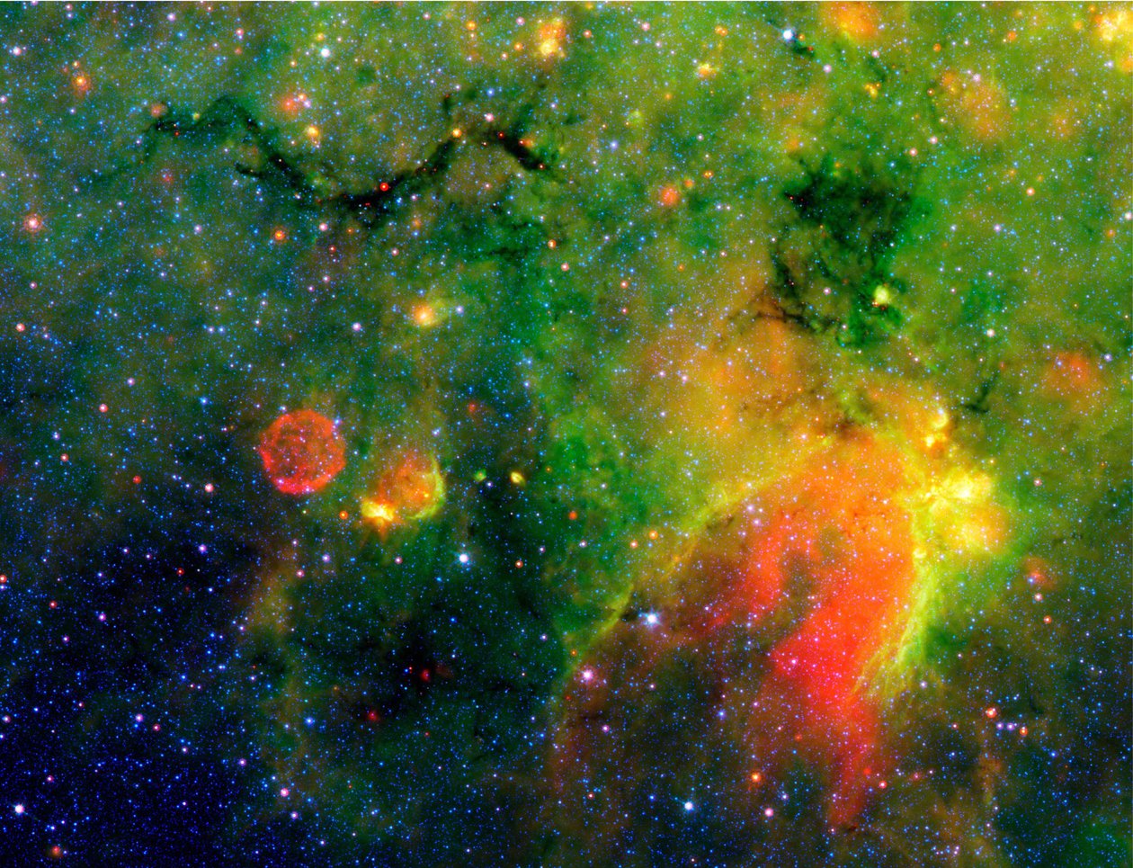 Spitzer Space Telescope infrarødt billede af en slange (øverst til venstre) og omkringliggende stormfulde omgivelser. Det er faktisk kernen i en tyk, sodet sky, der er stor nok til at sluge snesevis af solsystemer. Cred af National Aeronautics and Space Administration National Aeronautics and Space Administration
