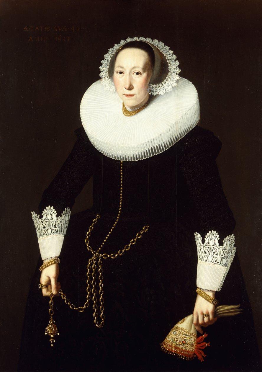 Portræt af en dame, stående i trekvart længde, iført et kunstfærdigt sort kostume, et hvidt ruff og blondemanchetter, med en guldkæde og et par handsker, 1633 af Nicolaes Eliasz